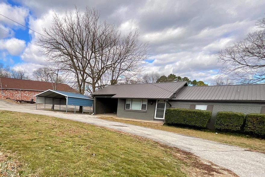 Updated 4-Bedroom Brick Home with Shop & Metal Roof - Move-In Ready! Welcome to 505 W 3rd St, a spacious and modernized brick home in the heart of Imboden. Offering 1,341 sq. ft. of living space, this 4-bedroom, 2-bath residence combines comfortable family living with impressive outdoor amenities, including a large detached shop and expansive deck. Step inside to an updated interior featuring durable wood-look vinyl plank flooring and fresh neutral paint throughout. The heart of the home is the bright kitchen, equipped with crisp white cabinetry, stainless steel appliances (including a sleek range and dishwasher), and contrasting dark countertops. Room to Grow: Four well-sized bedrooms provide ample space for a large family, home office, or guest quarters. Modern Baths: Both bathrooms have been refreshed with modern vanities, lighting, and fixtures. The primary bath features a walk-in shower, while the second bath offers a tub/shower combo with white surround. Storage: Includes a dedicated pantry area with built-in shelving and walk-in closet space. The exterior is just as impressive, featuring a stylish grey painted brick facade and a durable metal roof for peace of mind. The Shop