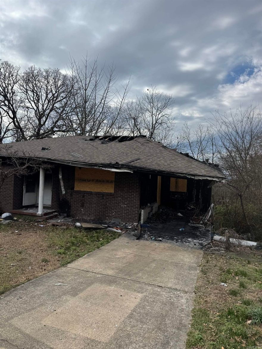 This property presents a rare opportunity for investors, builders, or visionaries to bring new life to a fire-damaged home. Situated in a desirable neighborhood, the structure has sustained significant damage and will require full renovation or rebuild. The location offers convenient access to local amenities, schools, and major routes, making it an ideal site for your next project. Whether you choose to restore its former charm or start fresh with a custom design, the potential here is undeniable. Sold as-is — bring your plans and imagination!