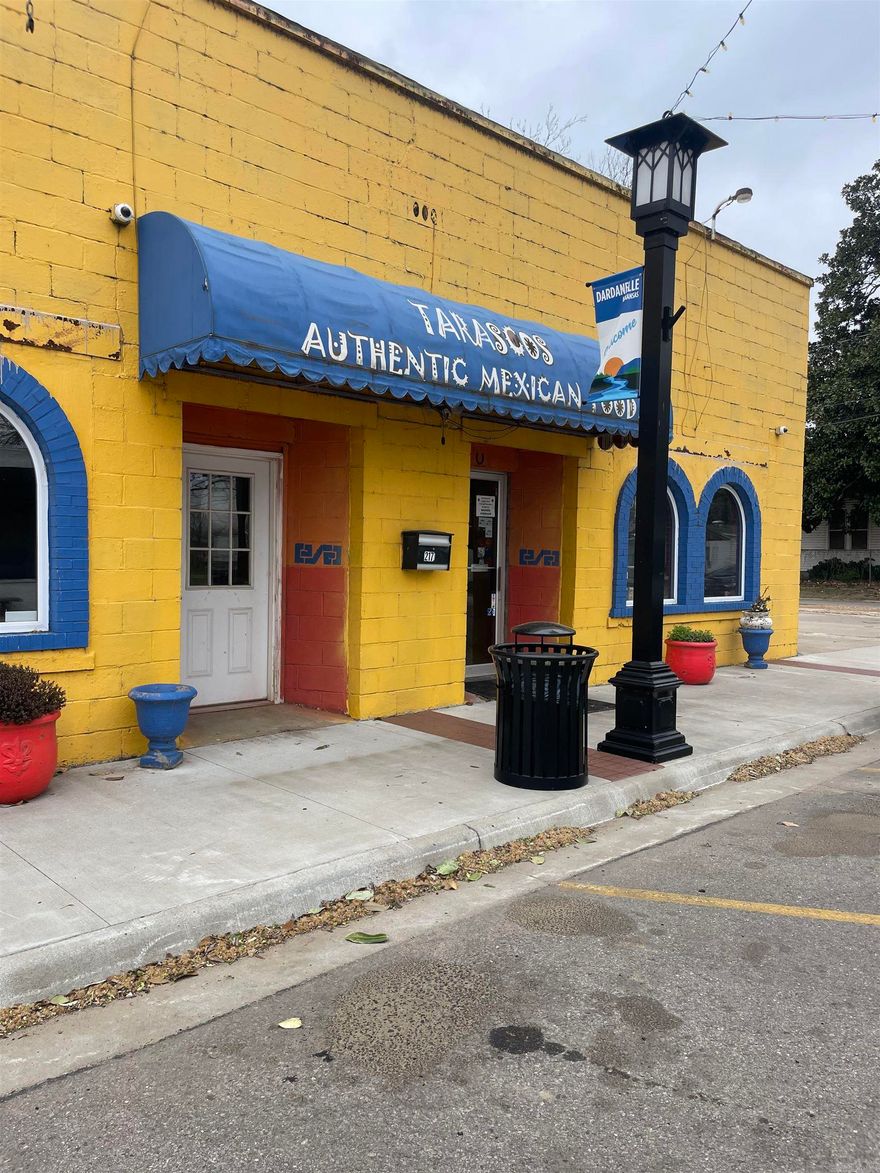 Rare opportunity for anyone looking to expand or enter the restaurant business! Situated prominently in Dardanelle on historic Front Street, ensuring high visibility and foot traffic. The property itself is part of the sale, providing a solid foundation for your business. All necessary kitchen equipment, walk in coolers, and furnishings are included, allowing for immediate operation. A collection of dishes and recipes will help maintain continuity or inspire new menu creations. The inclusion of a liquor license is a significant advantage, facilitating a full-service dining experience. Ample parking space available, making it convenient for patrons. An inviting outdoor seating area that can enhance the dining experience. You have the option to maintain the current operations or rebrand and customize it to fit your vision. This is a great chance to step into a well-established business in a vibrant community. Whether you're an experienced restaurateur or a new entrepreneur, the potential here is significant.