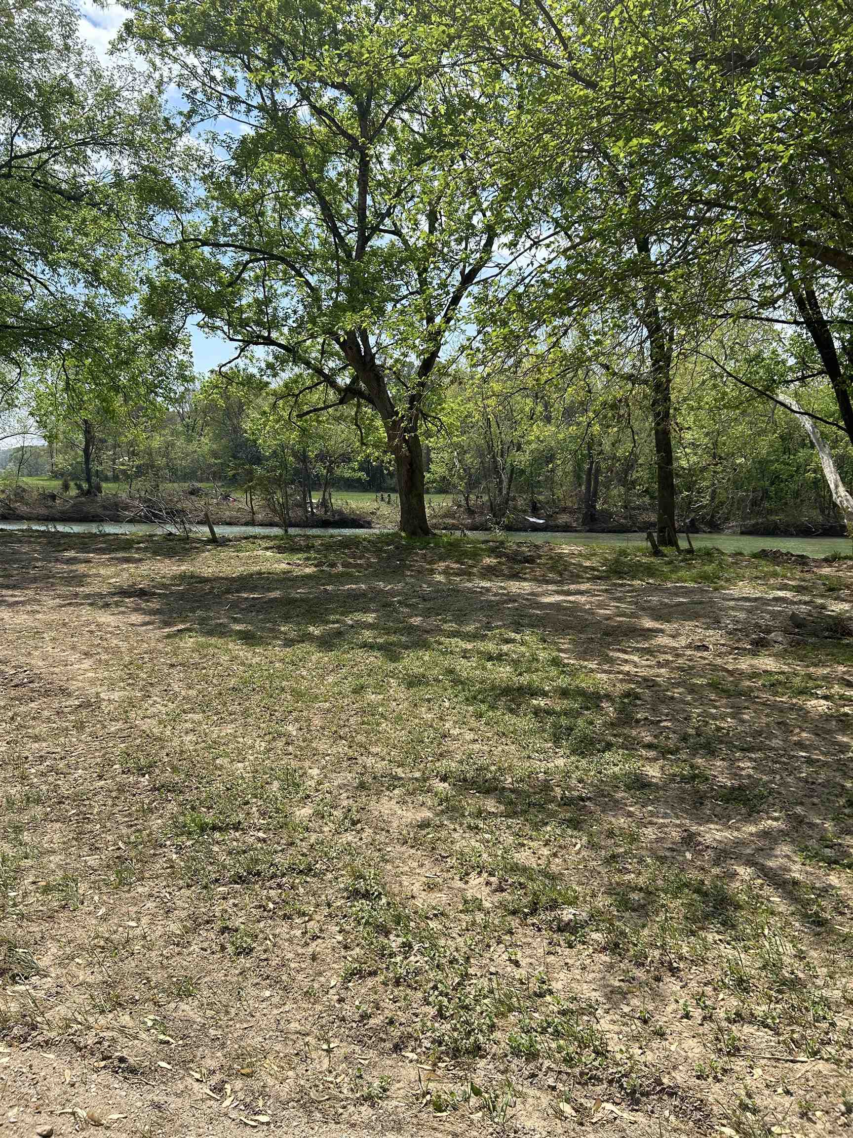 cleared lot on spring river, riverfront gated camping park with water hookup and electric at road. Swimming beach and boat ramp to launch your boat, also has a swimming pool