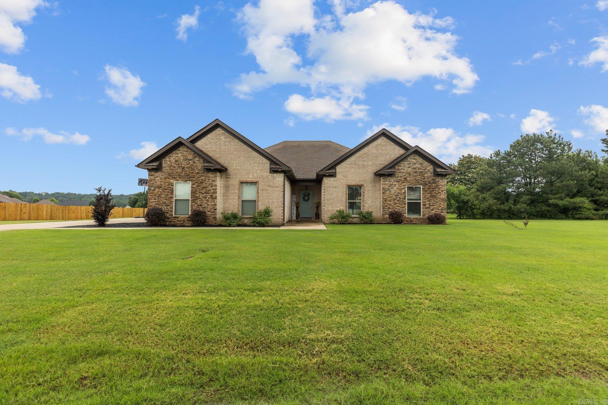 Welcome to your meticulously maintained 3-bedroom, 2-bathroom home on almost an acre in the coveted Huntington Estates subdivision! This home offers the perfect blend of comfort and class with its gorgeous kitchen with custom built cabinets, granite countertops & a large walk-in pantry. This split-level floor plan boasts 17 large windows throughout, radiating natural light. The primary bedroom and bath suite comes with double vanities, a jetted tub, standalone shower, and extra-large walk-in closet. All bedrooms feature high ceilings and large walk-in closets. Additionally features a two-car garage with an underground safe room built to hold 6 - 8 people. There was no box unchecked when this home was built. From safety to the ability to expand, it truly has everything. Come see it today!