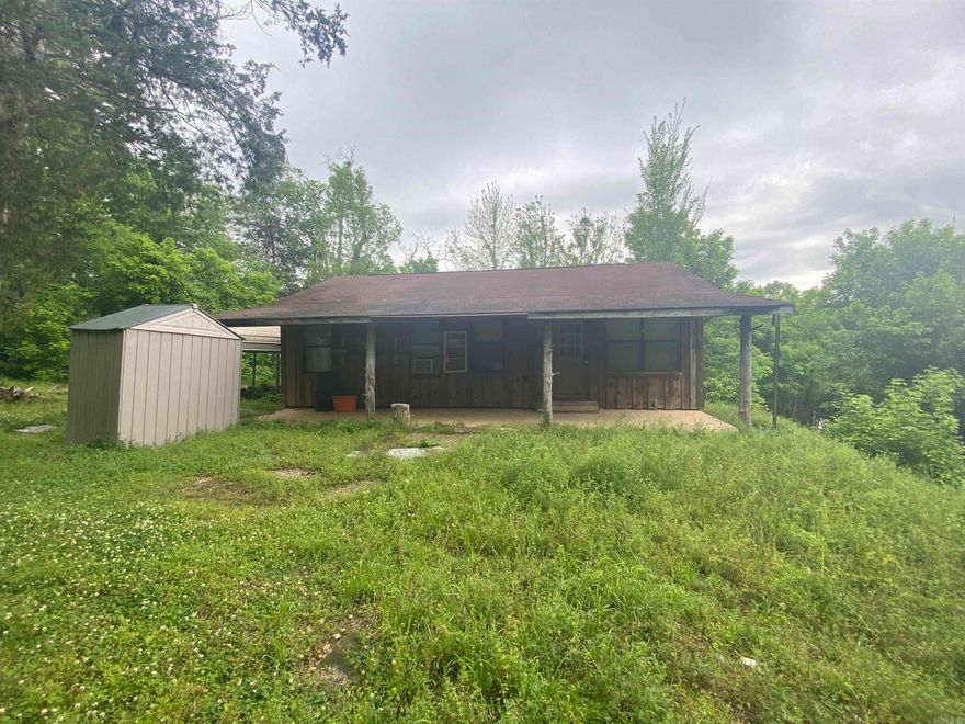 Look at this beautiful 18 acre mini farm in Mountain View Arkansas. This whole place is fenced and cross fenced with a barn and a 864 square ft cabin with a walkout basement and garage. The cabin is going to need some TLC but most of what is needed is cosmetic. It seems to have good bones. The property is beautiful with most of it cleared for fields and fencing all the way around it with a couple small ponds for livestock. The barn is in good shape with 3 stalls, a tack room and lean too off the side. Places like this are rare in todays time and at this price someone is going to get a good deal on a very nice piece of property. Call today to schedule a showing!!