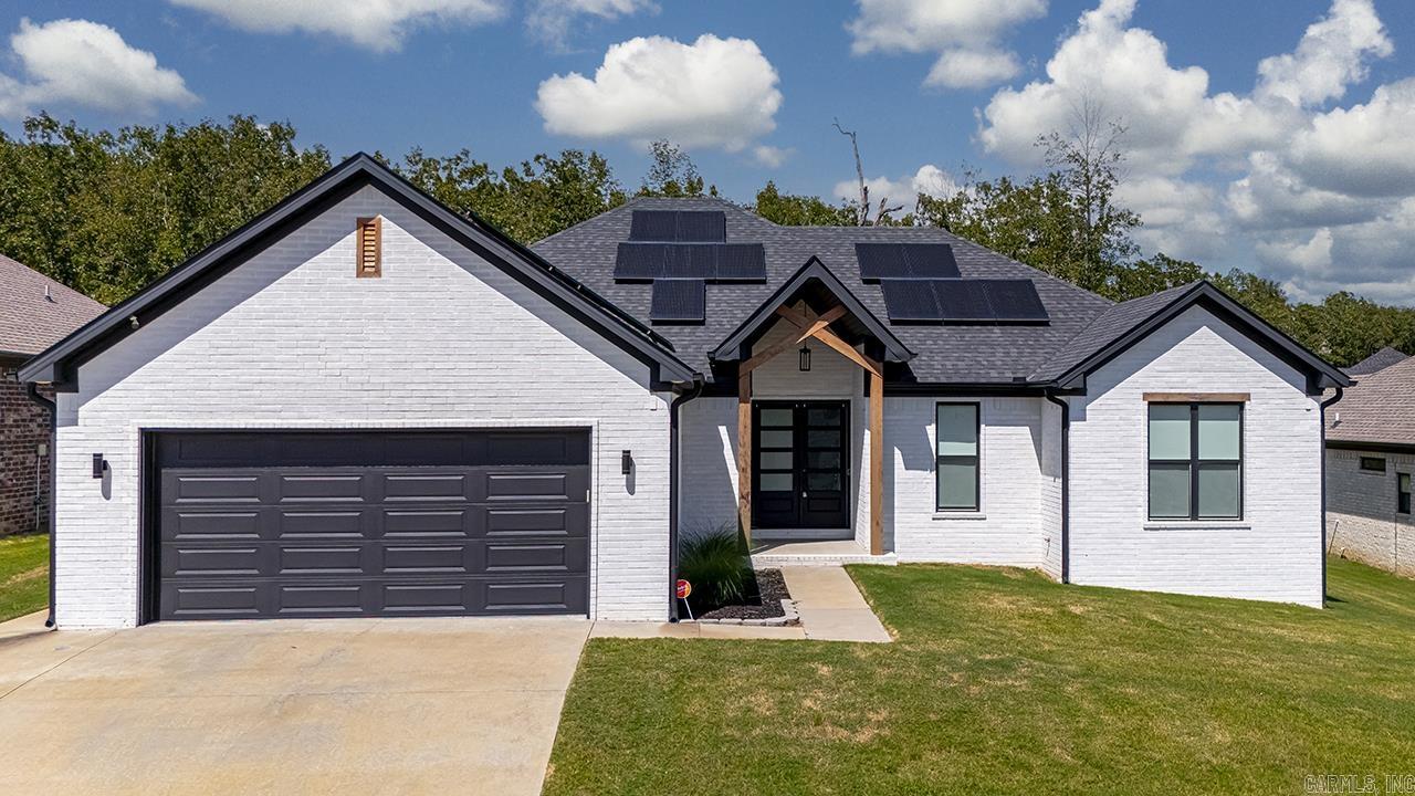 Luxurious home in Sherwoodās sought-after Millers Glen with incredible energy savings. Built in 2020, this one-story beauty feels like a custom build, offering high-end finishes, an open floor plan, and a spacious split-bedroom layout. The great room features a corner gas fireplace, crown molding, and large windows overlooking the backyard. The chefās kitchen boasts a bright island with breakfast bar, gas cooktop, wall oven, stainless appliances, walk-in pantry, and stylish backsplash. The private primary suite offers tray ceilings, a spa-like bath with soaking tub, walk-in tiled shower, dual vanities, and an oversized closet with direct laundry access. Three additional bedrooms share a modern full bath, plus a guest half bath near the garage. Outside, enjoy a covered patio, extended composite deck, and flat, fenced backyard. Energy-efficient construction with spray foam insulation, tankless water heater, and insulated windows/doors. Move-in ready and minutes to LRAFB, Camp Robinson, and Little Rock. (Solar is paid for and will convey)