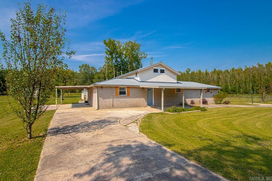 Looking for country living without the drive? Need a home for multi-generational living? Need space for all your toys? This house offers all of these amenities. Newly renovated home that boasts 4 total bedrooms and 3 bathrooms. There are 2 primary bedrooms ( one with it's own outside entrance perfect for in-laws ), as well as a bonus room that can be used as an office/playroom. House boasts 2400 sq ft of living space. Nice open concept kitchen/dining/living room with a fireplace and wet bar. House sits on .86 acres and includes 2 workshops ( one with a roll up door convenient for mower and lawncare equipment ), and a large 3 bay shop for the auto enthusiast. There is also a large chain link fence area for dogs/garden. This house has a lot to offer. Don't miss out on your chance to make this your new home. Book your appointment today! Agents see remarks