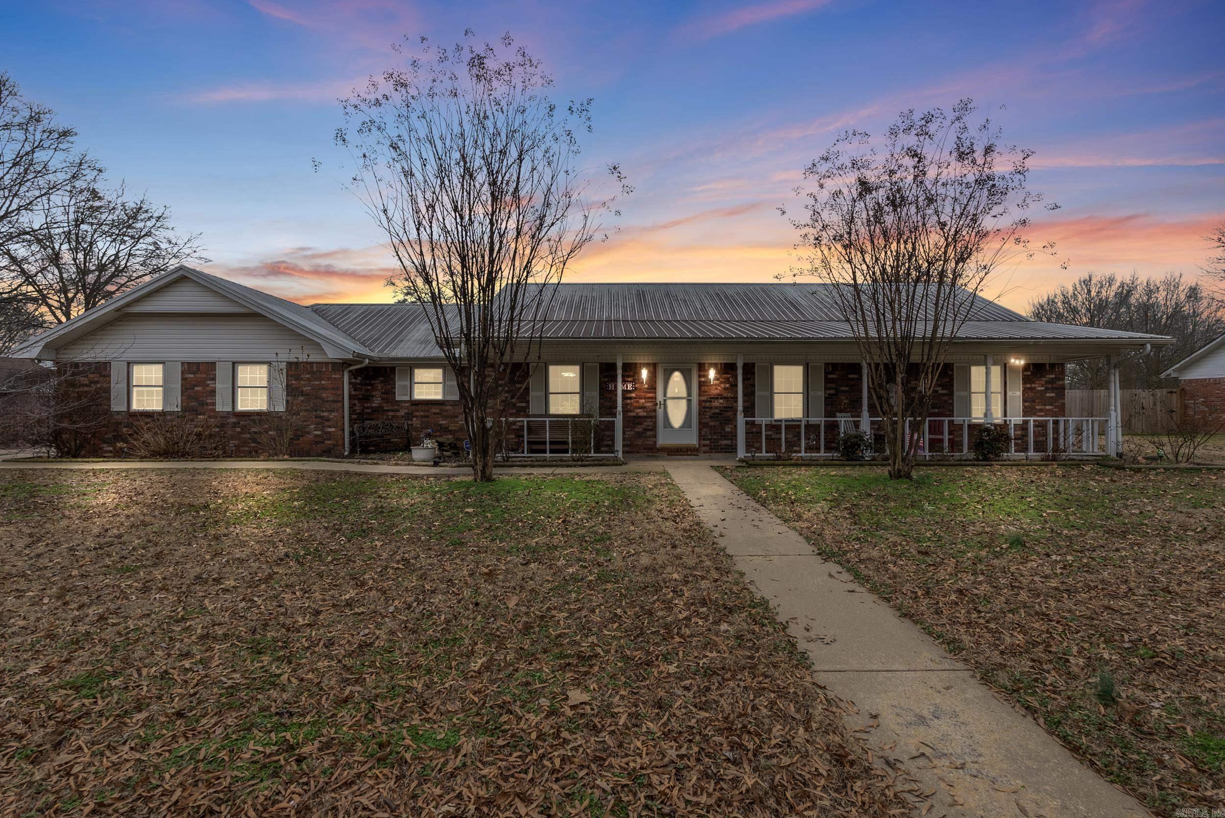 Welcome home! Located on a spacious corner lot in a well-established neighborhood, this home boasts three bedrooms and two bathrooms, and a 667 sq ft bonus/game room with a half bath—perfect for game-day entertainment or relaxation. The kitchen features a large island with a butcher block top and comes fully equipped with all appliances, including the refrigerator. Just off the kitchen, you’ll find a generous walk-in pantry. All the bedrooms are equipped with walk-in closets, and many of the light fixtures throughout the home include motion sensors for added convenience. Recent updates include a new 5-ton HVAC unit installed in 2023 and a newly replaced water heater, giving you peace of mind. Plus, the sellers are including the washer and dryer in the sale! Outdoors, enjoy a covered porch that spans the length of the home, as well as a covered patio/deck in the back, complete with a privacy fence for a relaxed, private setting. Additional amenities include a bonus detached 493 sq ft 2-car garage and a separate 280 sq ft storage building. All of this is ideally located close to shopping and dining! Schedule a showing today!