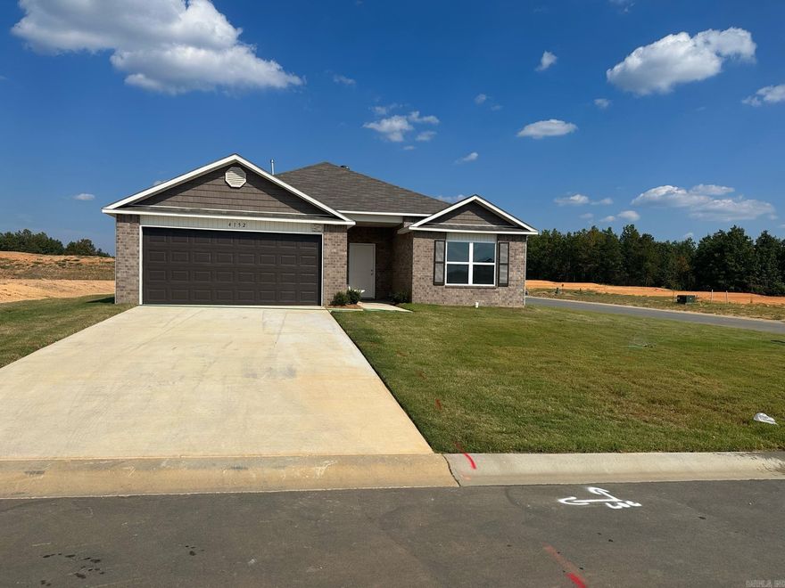 The Raleigh plan Upgrades in this home: 14x10 covered patio, 3050 Low E added window, 2030 tempered window added in Master Bath, soaker tub/shower combo in Master Bath, tub upgraded to jetted, 50 gallon water heater, add door bell, attic insulation upgrade, wall insulation upgrade, crown on Kitchen cabinets, staggered Kitchen cabinets, Luxury Vinyl Plank flooring in wet areas and Living Room and adjacent hallways, garage insulation package, finish and paint garage, bull nose corners, raise ceiling in Master Bedroom, Cheyenne style interior doors throughout, added door in Master Bathroom, attic stairs, LED disk lights in Kitchen and Living Room.