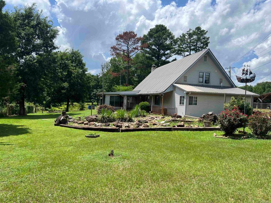 Nice two Story home that comes with 10+ acres and a pond outside of the City limits of DeQueen. Big home in need of some TLC; being SOLD AS IS and priced to sell! Property is fenced all the way around for Livestock! Home Features 3 bed/ 2 bath with a nice sunroom, new kitchen countertops and new carpet in the upstairs bedrooms.