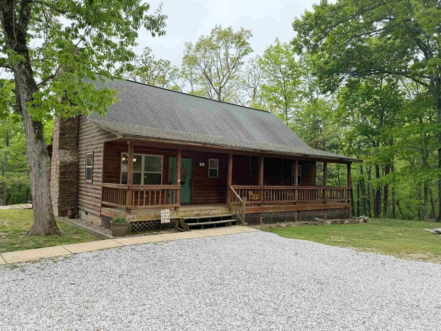 Escape to peace and serenity with this charming 1,736 sq ft log cabin just minutes from doowntown Mountain View. Nestled on 10 secluded acres, this 3-bedroom, 2-bath home features stunning 22' vaulted ceilings, a beautiful stone fireplace, and a spacious deck perfect for enjoying the outdoors. Inside, you'll find two bedrooms on the main floor, with a third bedroom and a bonus room upstairs that would make a great office, hobby room, or extra guest space. The property also includes a 30x20 barn-style outbuilding that can be used as a garage or for extra storage, along with a 16x10 partially finished outbuilding ready for your personal touch. Whether you're looking for a private getaway or a full-time home, this property offers the perfect blend of rustic charm and modern convenience.