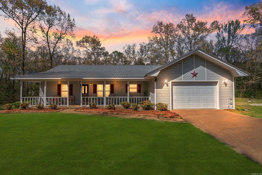 Gorgeous home on over 3 acres with a large shop, and only 4 minutes to Sugar Loaf Marina and beautiful Greers Ferry Lake! The 3 bed/2 bath split floor plan home boasts an open floor plan. Laminate wood floors in living room and bedrooms. Kitchen refrigerator stays with the home. Front and back porches are both covered, and are perfect for relaxing with a cup of coffee and enjoying nature. Extra landscaping that makes the outdoors pop. The home has a one car attached garage, and the detached shop has room for 2 more cars with operable motorized overhead doors. Shop has electricity. There is an in-ground storm shelter. The property also features a separate hookup for water/septic/electric that would be a perfect spot for an RV. Newer metal roof on both the house and shop. Home is plumbed for a generator.  If you enjoy fishing and boating on Greers Ferry Lake, but don't want to pay the high price to live right on the lake, this is an amazing opportunity.  You can be at the lake in less than 5 minutes. Easy drive to town. Mineral rights do not convey.