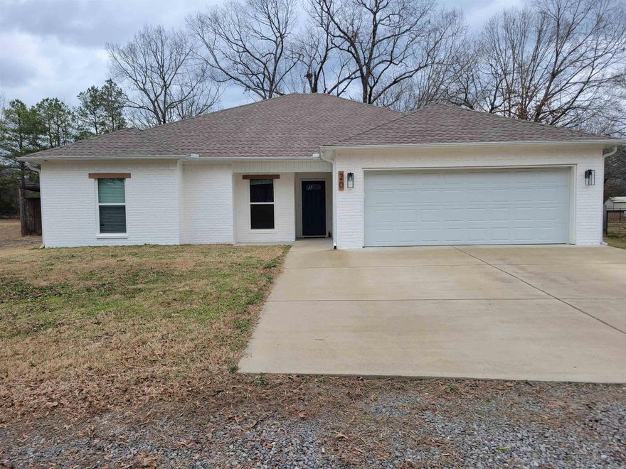 Welcome to your slice of country paradise with all the conveniences of city living!  Thoughtfully designed layout features a split floor plan with luxury vinyl flooring guiding you through the open spaces in this home.  Granite countertops and large breakfast bar invite culinary creativity, while a cozy gas fireplace sets the ambiance for evenings spent relaxing with loved ones.  Master suite features not one, not two, but three closets ensuring storage will never be an issue.  Step outside onto the covered back patio - perfect for hosting a barbeque with friends or simply enjoying quiet morning coffee.  Large fenced backyard perfect for pets and the treehouse makes it perfect for kids too!  The additional lot features a spacious pad, complete with electricity, perfect for your workshop or hobby space.  Raised garden beds are ready to be filled with your favorite salsa ingredients , promising farm-to-table freshness right at your fingertips.  Schedule your showing today and start living the life you've always imagined!