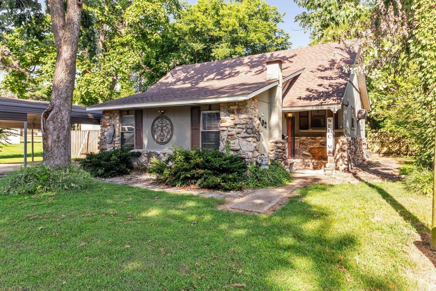 Looking for investment property or a "Cash Buy"?  This charming property may be exactly what you need!  Located in Corning and close to fishing lakes and Current River ... recreational water activities are just minutes away! AND this home is only a couple of blocks from an Elementary School and downtown Corning. Interior of this home features 2 bedrooms and a large hall bathroom which also serves as a laundry room and washer/dryer convey with the property. Kitchen is large with breakfast bar and appliances around 5 years old and refrigerator conveys with property as well. Step down into large living area with decorative/furniture gas log fireplace with rock wall detail and built-in shelving along another wall. And don't overlook the sunroom that provides additional "living space". Exterior features a fenced back yard, small patio and carport cover with additional parking space to the side. Improvements within the last 3 years include new roof, water heater and water/sewer lines but there is much work that needs to be done.  NOTE:  This house needs to be purchased with cash or an "In-house" loan ... being sold "AS IS" !