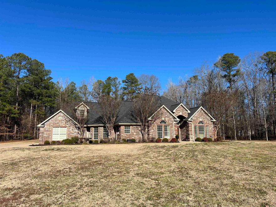 Welcome home to this 4 bed 2 and a half bath brick show stopper that sits on almost five acres where luxury meets comfort in every detail! The gourmet kitchen is a chef's dream, featuring top-of-the-line appliances, the living room is a focal point, adorned with large windows that bathe the space in natural light, highlighting the meticulous craftsmanship and attention to detail. Escape to the oasis-like backyard, where a meticulously landscaped garden surrounds a saltwater pool. This outdoor haven is tailor-made for entertaining, offering a perfect setting for gatherings with family and friends. This home is equipped with a whole house generator so you will never be left in the dark.  This home is a must see.