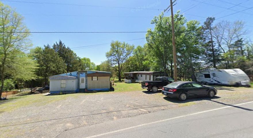 Great opportunity to own two mobile homes on nearly an acre—a rare setup that doesn’t come along often. This property offers a combined total of 6 bedrooms and 4 bathrooms, providing plenty of space and flexibility for multi-family living, guests, or rental potential. The cleared land stretches all the way to the back of the property, giving you room to enjoy, expand, or add value over time. Being sold AS-IS. Whether you’re looking for your next home with extra space or a smart investment opportunity, this one is worth a look! ( Mobile Home on the left side of property is 928 sqft, Mobile home on the right side of property is 952 sqft.