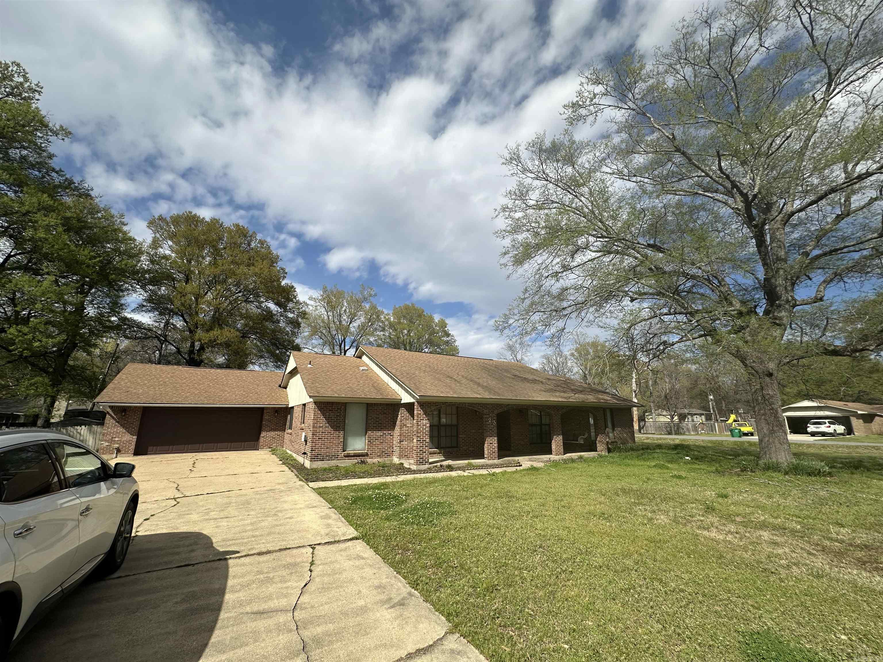 23 Shannon Drive, McGehee, AR This well-kept 3-bedroom, 2-bath home offers plenty of space inside and out! Features include: ⢠Large living room and den with wood ceilings and walls ⢠Cozy gas fireplace ⢠Separate dining room plus an eat-in kitchen ⢠Large laundry room ⢠Double vanity sinks in both bathrooms ⢠Spacious master bedroom with two walk-in closets ⢠Spacious screened-in porch overlooking a privacy-fenced backyard ⢠Double garage and large storage building ⢠New septic lines installed ⢠Roof is approximately 7 years old Sitting on a large corner lot (150x173) with 2,368 sq ft of heated space, this home has been well cared for and is move-in ready! Call or message today for more details or to schedule a showing