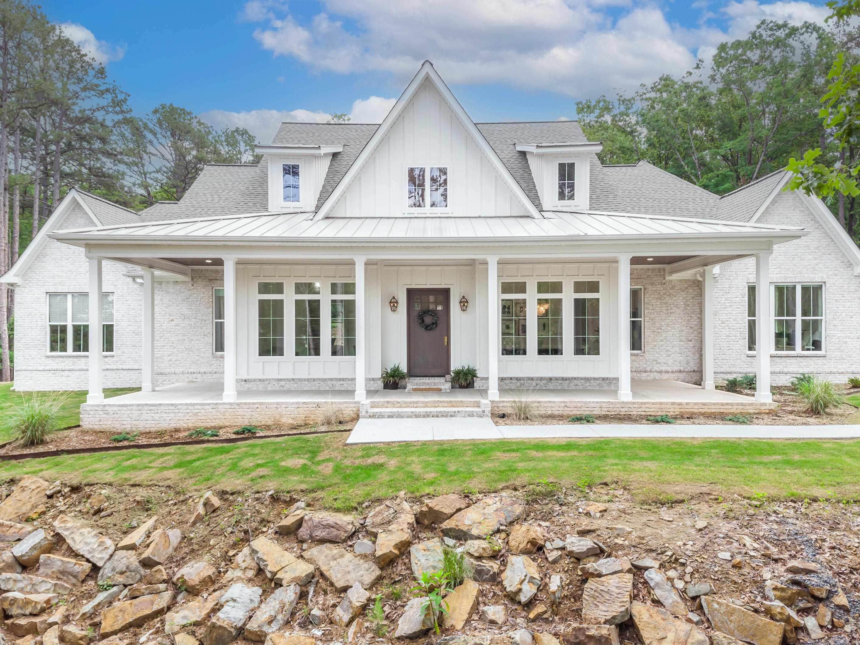 This light and bright home is all you will ever need. 4 bedrooms, 4.5 bathrooms, office, large butlers pantry with custom white oak door, large bonus room that could easily double as another bedroom, heated & cooled gym off garage, large covered patio with outdoor kitchen and so much more! Enjoy a nice and quiet setting but very close to town. It is picture perfect! WELCOME HOME!!!