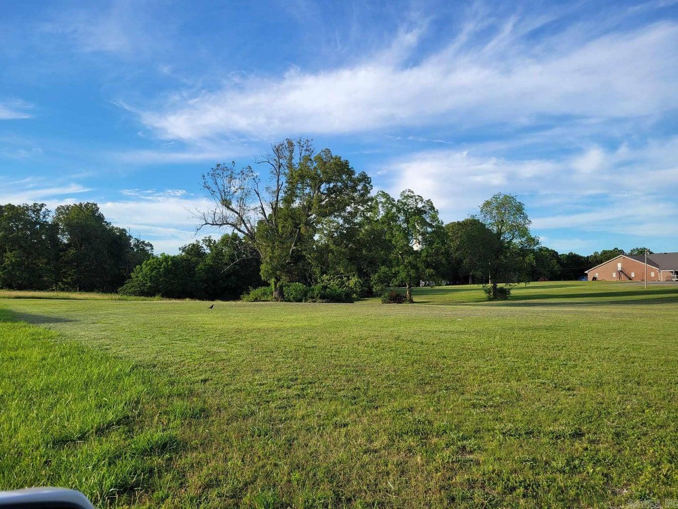 INVESTMENT OPPORTUNITY! Prime Highway Frontage Commercial lot ready for development. Lot contains 1.3 acres +/- and has 190 ft. +/- Highway frontage on US HWY 62/412. Estimated daily traffic counts of 8,500-9,600. The lot is situated close to Highland Schools and commercial developments creating lots of opportunities. Lot lies between the St. Bernards First Care Office and Highland Hills Baptist Church. Lot is 1.30 acres M/L. The listing agent is a relative of the property owner.