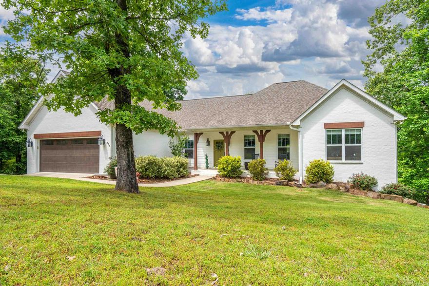 Welcome to this stunning custom-built home, completed in 2019, offering breathtaking panoramic views of West Mountain and Lake Hamilton. Nestled on a private 1-acre lot at the end of a quiet cul-de-sac, this property delivers the perfect blend of luxury, space, and serenity.  With 3,100 square feet of thoughtfully designed living space, this home features 5 spacious bedrooms and 3.5 bathrooms, providing flexibility for families, guests, or a home office setup. Beautiful hardwood floors flow throughout, adding warmth and elegance to every room.  The master suite is truly an oasis, designed for comfort and relaxation with ample space and privacy. The home’s flexible layout allows you to tailor the space to your lifestyle needs, whether for entertaining, working from home, or multi-generational living.  Step outside and take in the views from the expansive upper and lower decks—perfect for morning coffee, evening sunsets, or hosting gatherings.  Located in the highly desirable Lakeside School District, this property combines convenience with peaceful, private living.  Don’t miss the opportunity to own a modern, custom home with unmatched views and exceptional features.