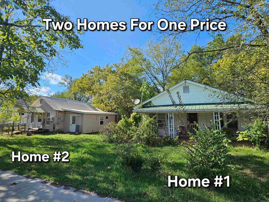 Two homes on separate lots in the charming Ozark Mountain town of Leslie! The main home is a cozy 2 BR/1 BA cottage just a few blocks from historic downtown. Features include a large front porch, a private back porch with no neighbors behind—only a peaceful open field—a carport with work area, and a storage shed. The home is lived in and comfortable, with some front foundation settling typical for its age. The second home (2 BR/1 BA) is not livable and given no value, but could be renovated for income potential such as a nightly or monthly rental. Both lots offer plenty of space for a garden or outdoor living. Enjoy small-town life in Leslie—known for its friendly people, antique shops, local cafes, and nearby outdoor adventures on the Buffalo National River