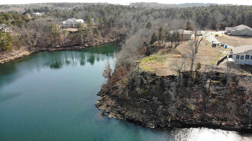 The premier lakefront lot available in Heber Springs!  Located in Wisdom Pointe, one of the very finest gated subdivisions in Heber Springs, Lot #9 ("The Pointe") is the largest lot in the subdivision and it has the most panoramic lake view!  Level lot that is ready to build on!  Utilities are underground...ready to go!  Taxes not yet determined.