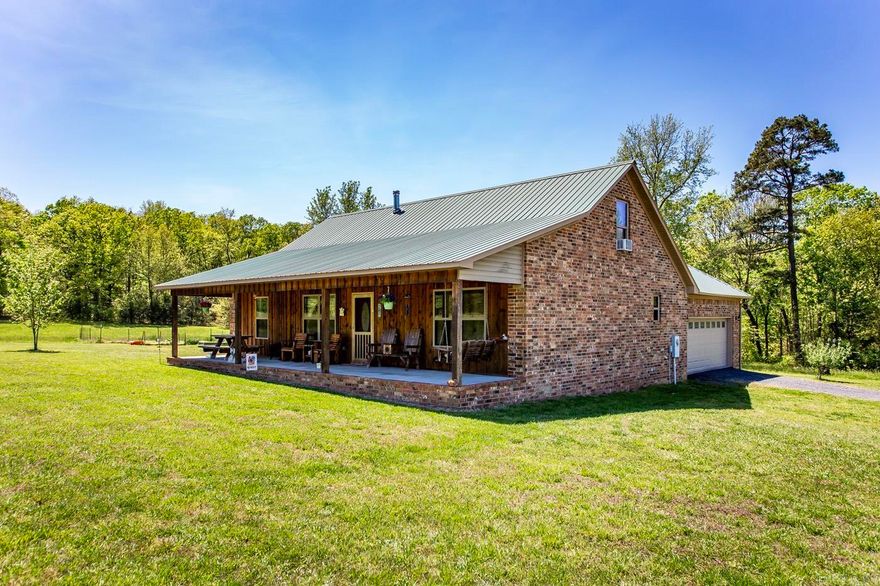 This 3 bedroom, 3 bath home sits on a beautiful 4.07 acres of pasture. Stained concrete floors add warmth and character throughout the home. Other features include tongue and groove vaulted ceiling, wood burning rock fireplace and custom pine cabinets. Each bedroom has its own bathroom and is a great feature for privacy and convenience. The fenced garden area, chicken coop, and newly built shed are wonderful additions for those who enjoy gardening or raising small animals. Sit on the covered front porch or the deck and enjoy the outstanding views from this property.