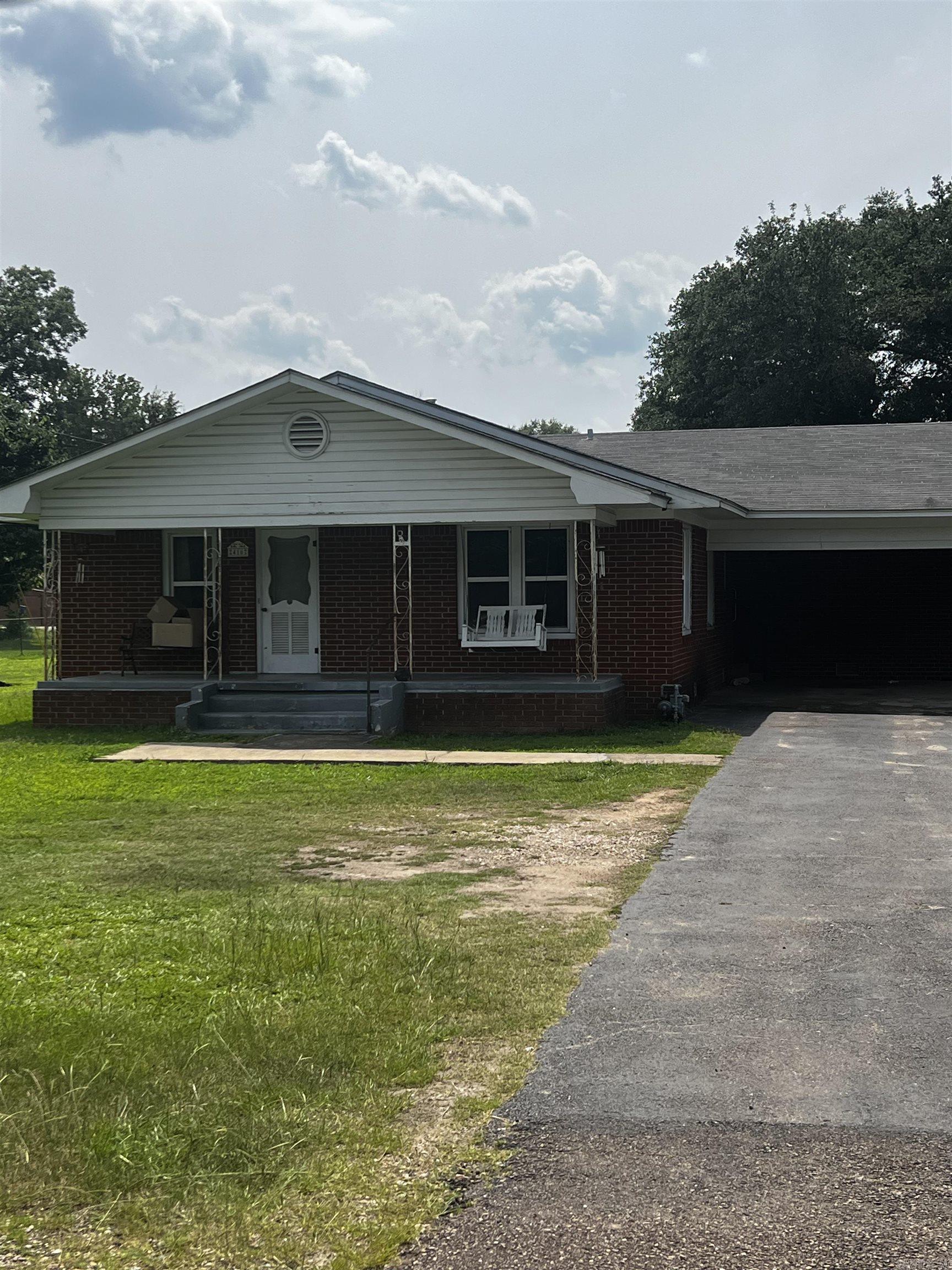 Brick home located in the Heart of Murfreesboro, minutes from the Crater of Diamond State Park and beautiful Lake Greeson. This home offers over 1,490 sq ft of living space, 3 bedrooms and 2 full baths. Double carport, screened in porch, chain link fenced yard and large 30x60 shop building situated on approx .49 of a acre. Contact our office for more details or to schedule a viewing.