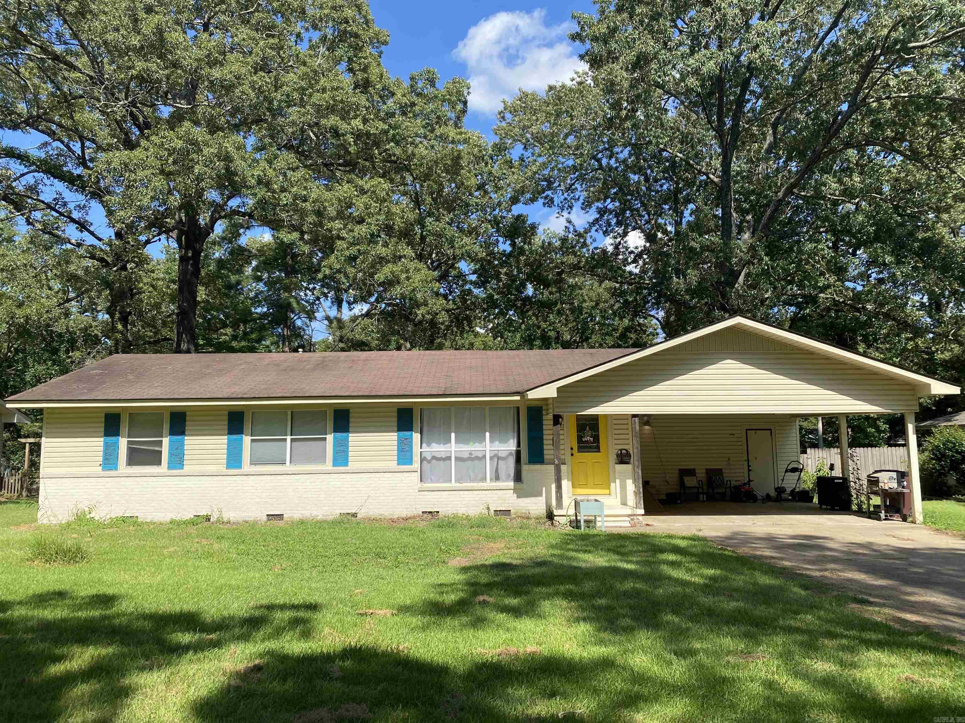 3 bed/2 bath, 1424 sqft, 0.36-acre lot. Real hardwood flooring. Open living, kitchen, dining. Update kitchen with quartz countertops, all appliances remain including. Walk-in closet in primary bedroom. Roof 2018, Gas HWH 2014, Central HVAC 2004 (AC compressor 2025). Two window AC units added for auxiliary noise, both will remain. Floored attic storage above carport. Interior will be professionally cleaned prior to possession.