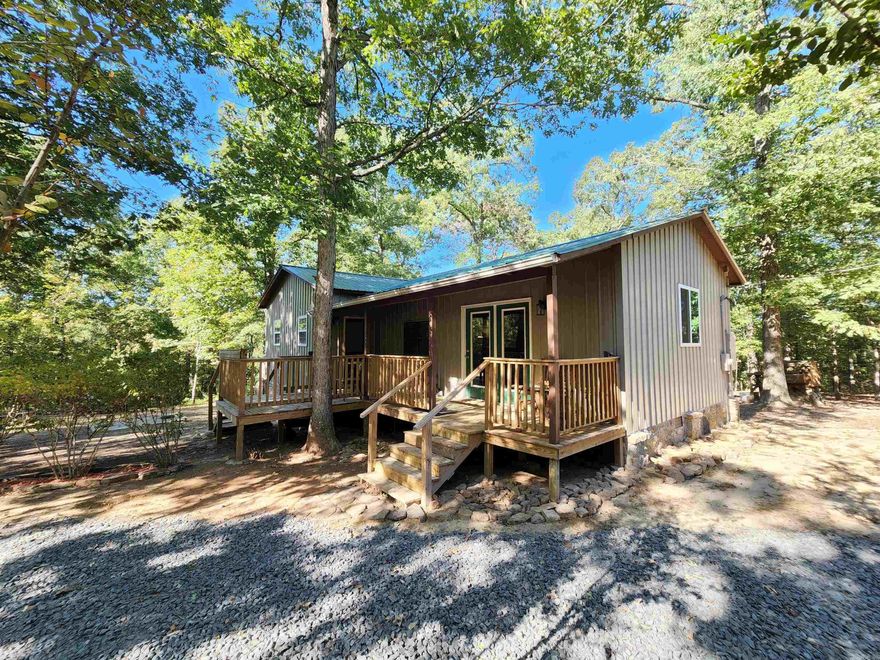 Welcome to market this Hunters Paradise that is nestled on 9 acres m/l  for your privacy, & serene surroundings. This cabin has been completely  remodeled making it almost new it offers spacious rooms, 9-foot ceilings, framed with 2x6s, metal siding & metal roof that sports a recently maintained metal roof, and lighted crawl space. The property is beautifully landscaped with mature oaks, crepe myrtles, dogwoods, peach trees, & a muscadine arbor. The cabin has been updated with central heating and air, attic is well-insulated, equipped with LED lighting, automated fan system that regulates heat & humidity, accessible via thermostat or smartphone. Custom counter made from 100-year-old repurposed barn wood, which is also used for the bar, bathroom counter, mantle, & sliding barn door. An additional water heater was placed under the kitchen sink to provide instant hot water when needed. The walk-in closet is lined with oak & cedar, master bed & bath feature fragrant cedar accents, a custom double vanity, and a jetted soaker tub. The large porch and deck features the perfect place for grilling & relaxation as well as a shooting rest for target practice. Call today for your tour