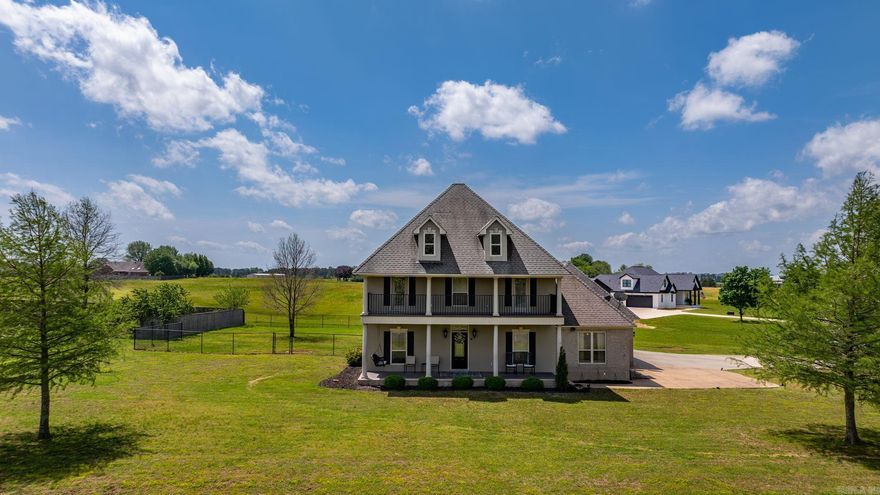 Enjoy access to your own private neighborhood lake that encompasses 55 acres. The neighborhood is centered around this beautiful fishing and recreation lake. Even if you never got on the water you can enjoy the beautiful view from your porch or deck. Very quiet location. 1 acre lot with fenced backyard. Room to build a pool or shop here! The home has a spacious kitchen with a large pantry. Laundry room has extra cabinetry and a sink. Downstairs you will find the kitchen, living room with gas log fireplace, separate dining room, primary bedroom, primary bathroom with walk in shower, 1/2 bath, and access to a back porch and the oversized front porch. Upstairs the hallway has built in desks, 2 bedrooms with a a jack and jill bath. Each bedroom upstairs has access to the deck with views of the lake. 2 car garage with a smaller golf car garage. This is a wonderful home!