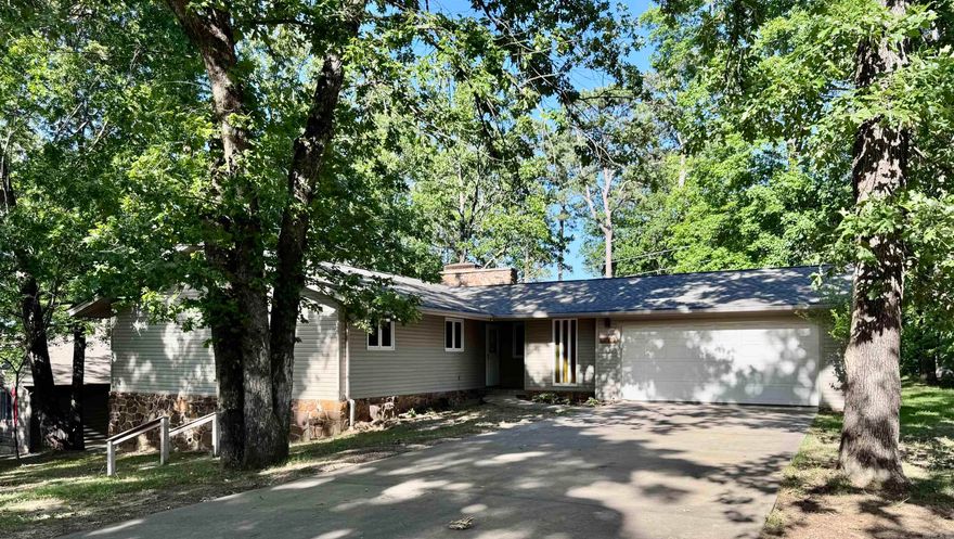 Wonderful 4BR/2BA home in a great neighborhood with a partial lake view, rock fire pit and mature trees! Features include a brand-new roof, newer hot water heater, spacious safe room, partial basement, and oak cabinets in the kitchen. Plenty of storage and space throughout. A must-see in a convenient location near the lake and a golf course! This property will not last long, call today for a showing!