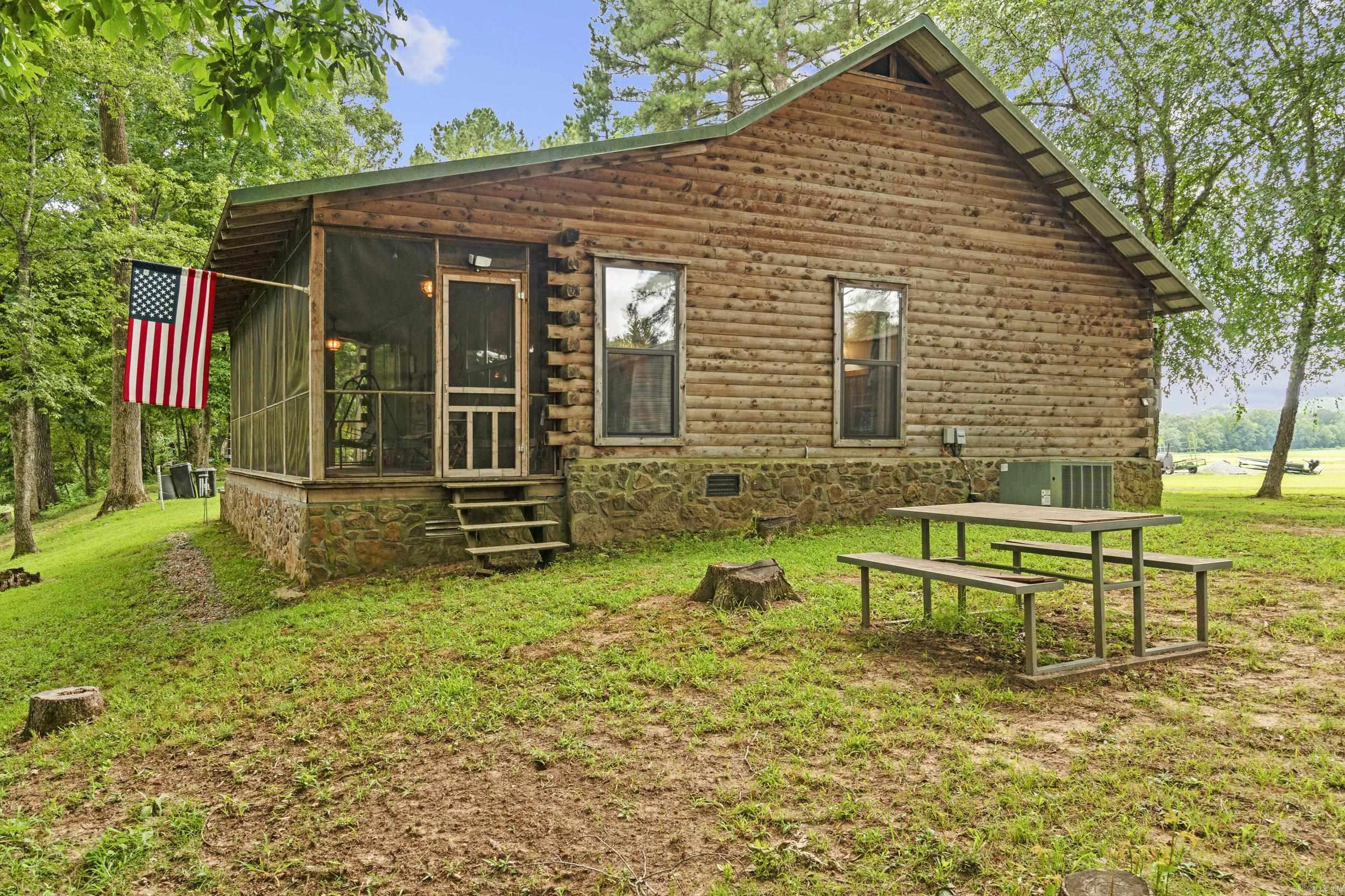 Welcome to your dream Little Red River getaway! Nestled on 2.73 acres along the pristine banks of the Little Red River, this charming 2-bedroom, 1-bathroom home with low-maintenance metal roof offers the perfect balance of comfort, privacy, and outdoor living. Whether you're looking for a full-time residence, weekend retreat, or an income-producing short-term rental, this cozy log cabin is move-in ready and packed with rustic charm. The open living area features natural light and views of the river, while the updated kitchen and bath make everyday living convenient and enjoyable. The screened in porch allows you to enjoy those summer evenings with no bugs! Step outside to enjoy a true nature loverās paradise ā your own private boat dock makes trout fishing, kayaking, and boating just steps away from your back door. With nearly 3 acres of gently sloping land, thereās room to expand, garden, or simply relax and enjoy the wildlife. Located just minutes from downtown Pangburn and a short drive to Heber Springs or Searcy this riverfront gem offers tranquility without sacrificing convenience.