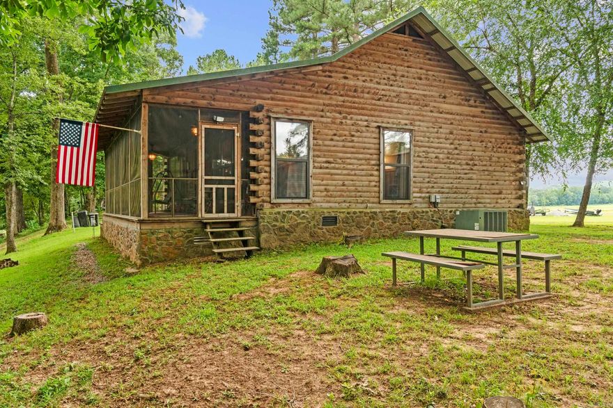Welcome to your dream Little Red River getaway! Nestled on 2.73 acres along the pristine banks of the Little Red River, this charming 2-bedroom, 1-bathroom home with low-maintenance metal roof offers the perfect balance of comfort, privacy, and outdoor living.  Whether you're looking for a full-time residence, weekend retreat, or an income-producing short-term rental, this cozy log cabin is move-in ready and packed with rustic charm. The open living area features natural light and views of the river, while the updated kitchen and bath make everyday living convenient and enjoyable. The screened in porch allows you to enjoy those summer evenings with no bugs!  Step outside to enjoy a true nature lover’s paradise — your own private boat dock makes trout fishing, kayaking, and boating just steps away from your back door. With nearly 3 acres of gently sloping land, there’s room to expand, garden, or simply relax and enjoy the wildlife.  Located just minutes from downtown Pangburn and a short drive to Heber Springs or Searcy this riverfront gem offers tranquility without sacrificing convenience.