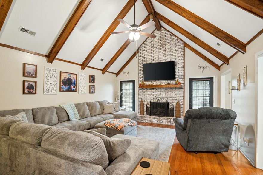 Peaceful Retreat Near Lake Poinsett | 3 Bed | 3 Bath | Over 2,000 SF | 2.17+/- acres. Welcome to your serene woodland escape on 2.17 +/- acres, just a half-mile from Poinsett State Park! Nestled on a beautifully wooded lot with privacy and nature all around. This 3-bedroom, 3-bath home offers over 2,000 square feet of comfort, character, and room to grow. Inside, you'll fall in love with the warm hardwood floors, natural light from two bay windows, and a cozy living room with vaulted ceilings, exposed beams, and a stunning whitewashed brick fireplace. The kitchen is full of charm and function with white cabinetry, dark countertops, natural gas cooktop, breakfast bar, beautiful brick flooring, and a gorgeous tongue-and-groove wood ceiling that adds flair. A flexible (main floor) bonus room with built-in shelves can serve as an office or even a fourth bedroom. Storage is abundant with multiple closets, a large floored attic, and an additional storage closet in the two-car garage. Step outside onto the expansive back deck, perfect for entertaining or simply relaxing while surrounded by peaceful woods. There's space for grilling, a fire pit, and multiple seating areas.
