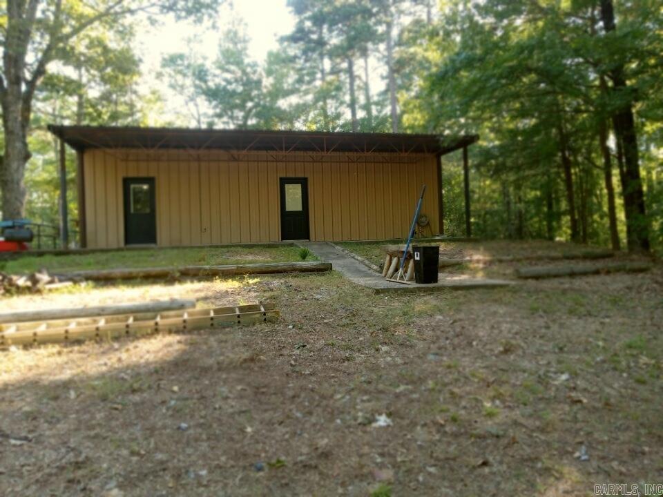 Residential and commercial potential in this property that has deeded access to the Mountain Fork River - located at the old Camp Pioneer campground! Big oak and pine trees grace the 2 acres, and there are wonderful mountain views from the large front porch. Two bedrooms and one of these could easily be split into two bedrooms, plus bathrooms that are handicapped accessible. The kitchen was built into the structure after the last purchase, and features a dishwasher and stove, plus nice new cabinets. Large living area, and a separate laundry room. Two bathrooms, one for each bedroom. So many possibilities with this structure, such as commercial ventures, use as a personal residence, or even as a nightly vacation rental! The ability to have access to the river is a major benefit - all located on a paved road. You gotta see this! Photos of the river are of the river ACCESS point.