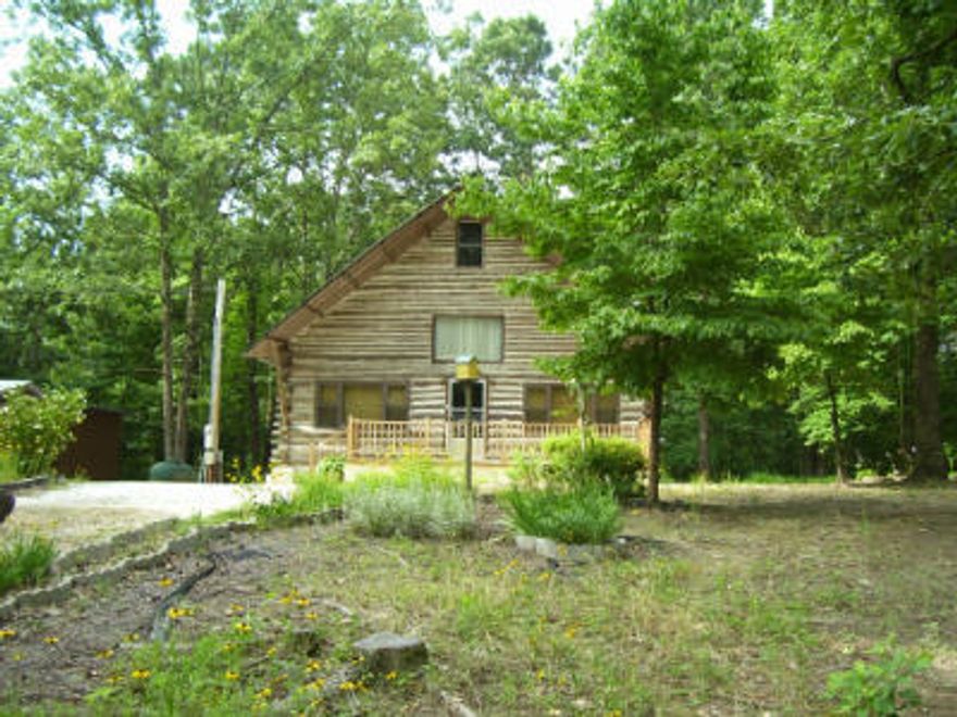 REDUCED TO $54,900.00.  PERFECT GETAWAY NEAR LAKE DEGRAY! WONDERFUL LOG HOME features 2 Bedrooms, 1 Bath. An 8' x 24' front deck leads into an open floor plan which includes kitchen/living room with an old fashion propane stove in center of area. Wood steps leads to the second level and you'll find a 15' x 30' bonus room. Enter the back deck (8' x 20') through the laundry room and enjoy relaxing after a day on the lake. This beautiful .98 ACRES +- . SOLD 'AS IS'