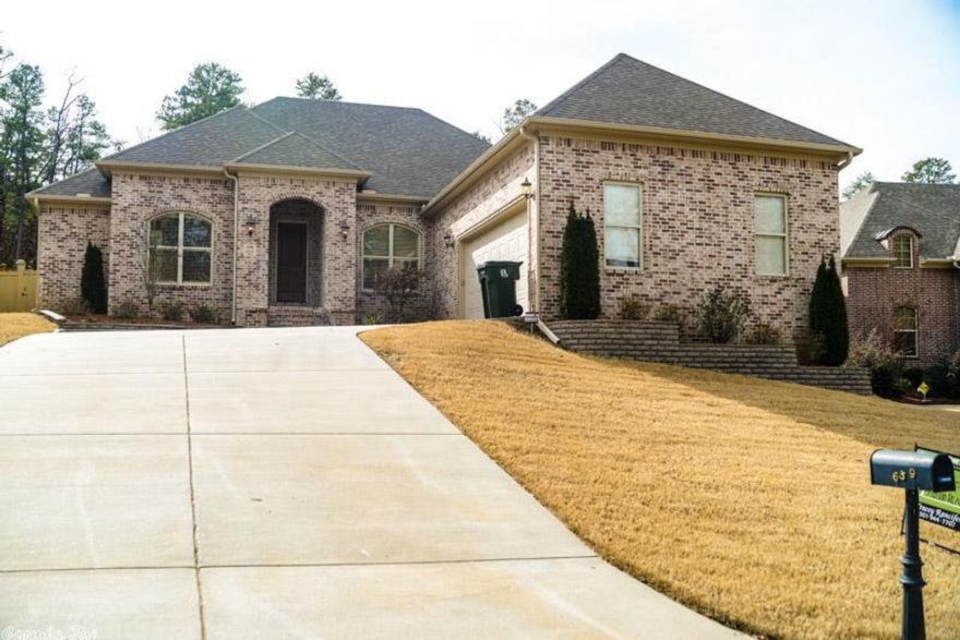 Stunning Chenal Valley home! One level, open floor plan with fabulous decorator touches throughout.  A delightful chef's kitchen opens to the spacious hearth room with gas log fireplace. Elegant formal dining and living room. Separate master suite includes private water closet, jetted tub, separate shower and his/hers vanities. Fully fenced private rear yard backs up to dedicated green space. Covered patio area for outdoor entertaining.