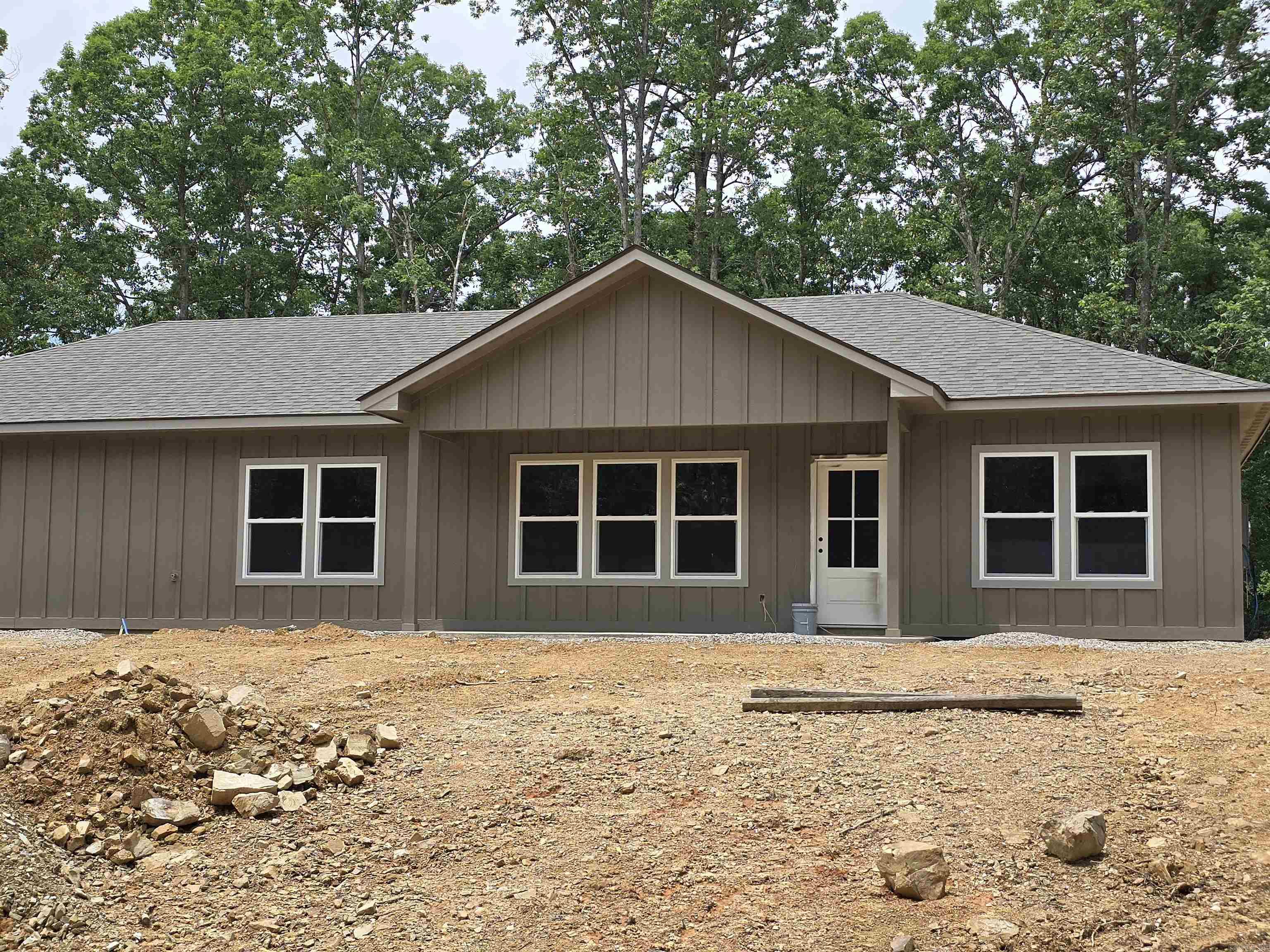 Perfect new construction home on a level lot. Home is currently under construction in the framing stages...completion date October 2025 Located in Diamondhead, a secure community only a few minutes from Hot Springs. The community includes a PGA sanctioned 18-hole golf course, lake access for everyone, Olympic size swimming pool, children's playground, tennis & basketball courts and abundant wildlife most notably the American Bald Eagle. Only a few miles from Lake Catherine State Park... You are gonna love it here! the picture is of a previous similar home built by owner
