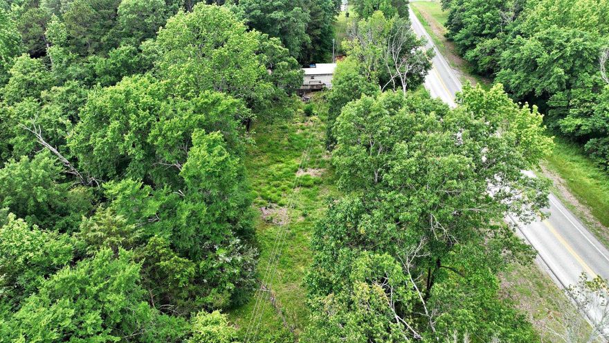 Located just minutes from Wilhelmina Lake in beautiful Mena, Arkansas, this 0.77-acre property offers a rare opportunity with several valuable features already in place. The land includes a well, septic system, and power. With highway frontage and a year-round creek running along the property, access and natural beauty are both highlights of this parcel. A very nice storage shed adds additional utility and storage space. An older mobile home is also on the property, but it is being sold at no value—its floors are caving in, and access to the interior will require a signed hold harmless agreement. This is an estate sale and is subject to court confirmation. The property is being sold as-is, and the seller will make no repairs or remove the mobile home. This is an ideal spot for someone looking to invest, build, or enjoy a peaceful rural setting with key infrastructure already in place. All showings and viewings require an appointment. Surveillance cameras in place.