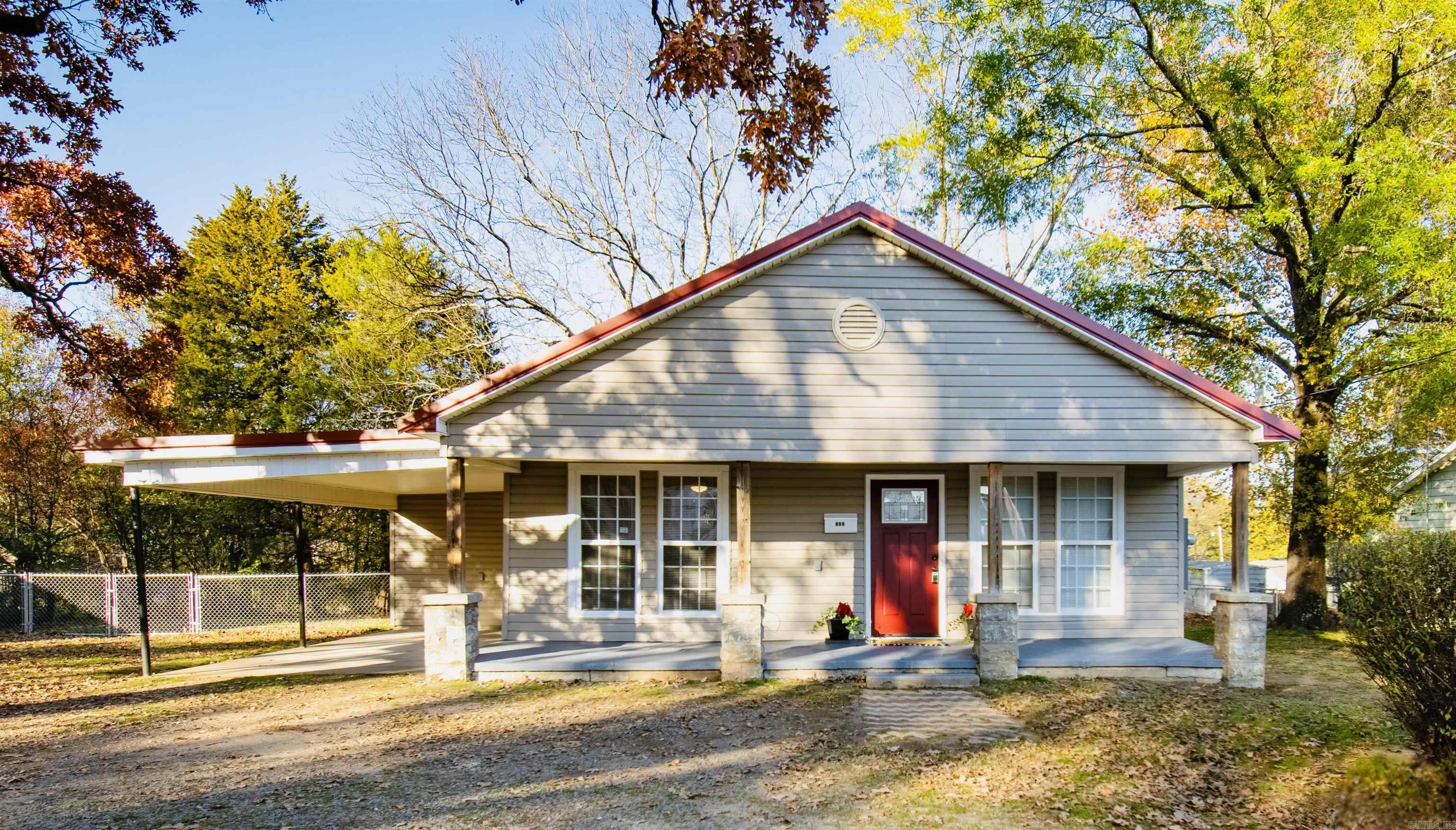 This beautifully renovated 2-bedroom, 1-bath home offers modern living with small-town charm. From the inviting 8’x28’ front porch to the spacious, fenced backyard, every inch of this property has been thoughtfully updated. Highlights include Open-concept living, dining, and kitchen area with brand-new granite countertops, stainless appliances, lighting, and crown molding. All-new:foam insulation, sheetrock, flooring, electrical, plumbing, ductwork, and paint throughout. Spacious bedrooms, walk-in closet and luxurious hall bath featuring a walk-in shower and granite vanity.Dedicated laundry room with built-in cabinetry and washer/dryer hookups. Maintenance-free exterior with newer siding, metal roof, and windows. Huge yard with a brick patio and 20’x10’5” storage building. Conveniently located near hospitals, shopping, and the interstate. Move-in ready and perfect for comfortable living!?? 103 E. Rock St., Morrilton Don't miss this one-of-a-kind property!