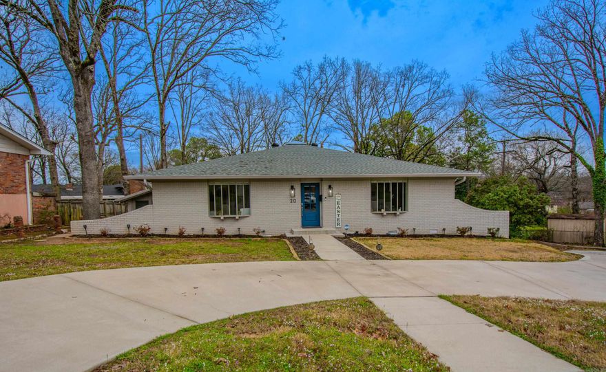 Totally remodeled and with an open floor plan.  Whole house has New lighting, new flooring, new windows, new roof, new circle drive, & new paint.  Kitchen has new upscale cabinets, new grante tops, island added, coffee bar added, new appliances, new sink ect.  All baths remodeled with new tile, vanitys, granite tops and new lighting. Den has a wet bar with a wine fridge.  3 bedrooms on the main level.  2 with ensuite baths, a total of 3 baths.  Downstairs has one bedroom and one bath.  Great for college kids, inlaws or short term rental (pending city approval).  New covered deck thats tied into the roof.  This home reflects quality at every turn.  See attached update list.  Top many updates to list