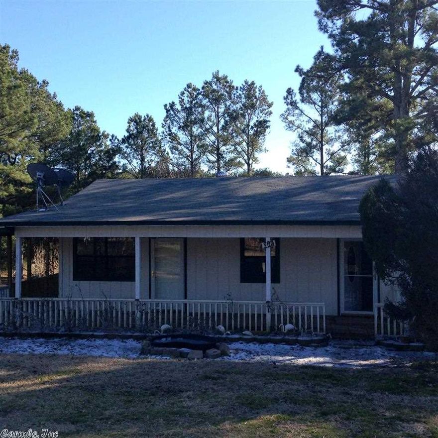 Diamond in the Rough!  A little handiwork will make you the proud owner of a 4 bedroom 2 bath country home on one acre in Bonnerdale.  The master is on one side of the house  with a separate entrance, walk in closet, bath with shower. Nice kitchen, open living/dining area.  And then there is a newer 600sf +/- back porch with insulated windows that could easily be heated and cooled.  Pretty back yard. Only a mile from Hwy. 70 and just inside Hot Spring Co. as you leave Garland Co.