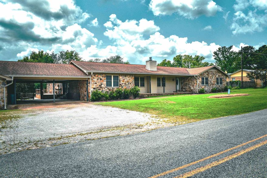Back on Market Due to Buyer’s Change of Plans – Don’t Miss This Second Chance! This 3,889-sqft gem is UNIQUE! The space is prime for a family retreat, a thriving commercial space, or a hub for community activities. This versatile property features 4 beds/3 baths, & flex rooms that offers space & functionality. Visualize gatherings, or crafting culinary treats in the oversized kitchen. Outside, enjoy the fresh air on the spacious 2-level deck or relax under the covered & open patios, perfect for soaking in the fresh Ozark breeze. A standout feature is the 24 x 30 space, with plumbing & electric making it perfect for your personal endeavors or business. The property also has a 4-car carport & 1 car garage with workshop for ample parking. With multiple access points, convenience is a given, & the 20KW natural gas generator ensures reliable power. This is an incredible opportunity for a generational family, investors looking for multi-family rentals or for city/county officials seeking to utilize its prime location & expansive layout for community projects or offices. Let us help you envision your future in this amazing property! Recent appraisal price changed accordingly