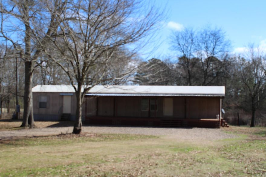 3 Bedrooms, 2 full baths / MOBILE - MANUFACTURED HOME with approx. 1088 Sq. Ft. of living space. situated on approx. 2.68 acres in a rural setting.  Home has central A/C & Heat.  Range, refrigerator and washer & dryer conveys with sell of home.