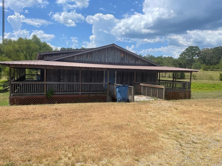 Wonderful 3 Bedroom 1 1/2 Bath Home with open floor plan on 10 Acres. Refrigerator, Dishwasher and microwave. Central Heat/Air Unit. 8 ft wide porch all the way around the house. Barn has stalls for horses and has also been used for events and auctions. Property has access to creek. Great country property can have horses, cattle, chickens, pigs. Huge garden spot. Property will also be listed for Rent with entire 10 acres.
