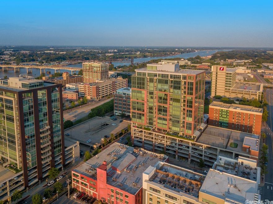 Breathtaking downtown views! Perfect for entertaining with front row seating to the amphitheater and view of the capitol! This stunning 2 bed 2.5 bath downtown condo will leave you speechless. With gorgeous travertine flooring, quartz countertops in the custom kitchen, cozy fireplaces and walls of windows and an automated window shade system! Elegant office/den off the great room. Beautiful walk-in shower in both bathrooms as well as custom cabinetry/built-ins. TONS of storage throughout including separate heated/cooled storage room.  Building has Security and concierge, pool, exercise room, dog walk, and an excellent restaurant. Condo comes with 2 parking spaces. Agents please see remarks.