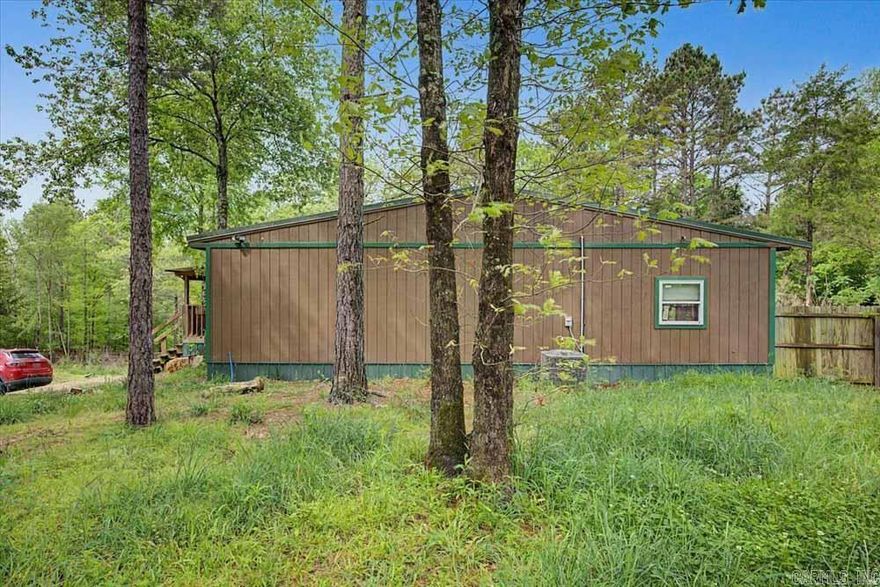 Need some elbow room?  Take a look at this five bedroom/2 bath home on ten+ acres just West of Amity, Arkansas.  It was constructed 1n 2020 and features an open floorplan, combining the living room, kitchen and the dining area.  Most of the property is covered in timber.  One half acre has a privacy fence.  High speed internet is available.  The home is occupied so provide advance notice to the listing agent to schedule a showing if possible.