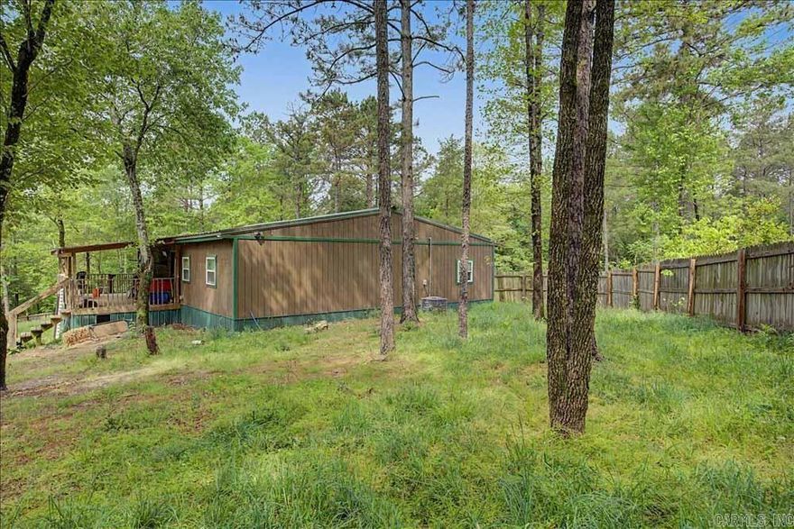 Need some elbow room?  Take a look at this five bedroom/2 bath home on ten+ acres just West of Amity, Arkansas.  It was constructed 1n 2020 and features an open floorplan, combining the living room, kitchen and the dining area.  Most of the property is covered in timber.  One half acre has a privacy fence.  High speed internet is available.  The home is occupied so provide advance notice to the listing agent to schedule a showing if possible.