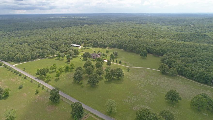 Looking for that DREAM property in the OZARKS for your estate, ranch, farm or family compound?  With 110 acres (a mix of pasture and timber), there's plenty of room for anything you want to do including raising livestock or hunting on property.  Need a separate space for a workshop, car collection or recreational/hunting gear? The 6,000 + sq ft shop building on property, with 4 loading doors (including one dock door) and office/apartment space, provides lots of options. Be sure to check out the video to tour through this beautiful 10,000+ sq ft custom 3-level brick home that includes 7 bedrooms, 5 full & 3 half baths, 6 gas log fireplaces & double garage. With 3 full kitchens and laundry rooms on each floor, this can be an ideal home for a large or multi-generational family.  An elevator services all three floors. The property also contains a garden house & whole house propane generator.