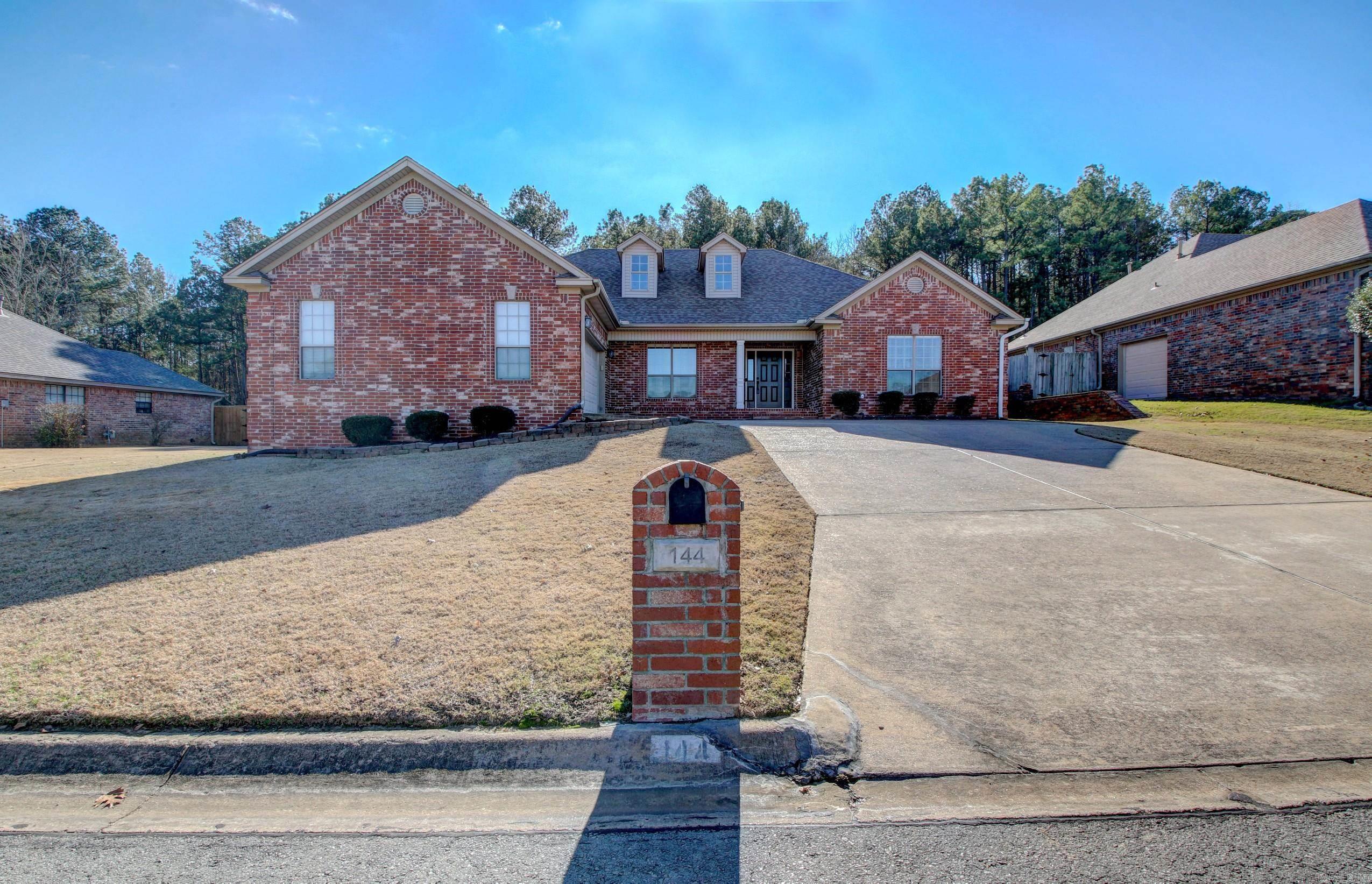 Nestled in sought after Maumelle, this beautifully maintained home offers a desirable split floor plan with high ceilings and stunning hardwood floors throughout the main living areas. The oversized living room flows seamlessly into a formal dining room, perfect for entertaining. Cozy fireplace for those chilly days! The kitchen is features an island with ample storage and workspace. A spacious laundry room adds convenience to your daily routine. The primary suite boasts a private bathroom and a generous walk-in closet, providing a peaceful retreat. Outside, the fully fenced backyard offers a private woodland setting with a concrete patio—ideal for relaxing or hosting guests. The side-load garage adds both functionality and curb appeal. If you're searching for a move-in-ready home with style, comfort, and easy access to Maumelle’s amenities, look no further!