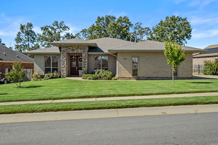 Beautiful inside and out! Check out this fantastic Sherwood home with charm from the stacked rock facade on the exterior to amazing stained and etched concrete floors on the inside. Enter to find a spacious and open formal dining area along with a designated home office, with laminate flooring, which could also serve as a 4th bedroom. The open kitchen/ living floor plan makes this a great home for entertaining! The living area has a cozy feel thanks to the gas log fireplace with electric start. Granite countertops and stainless appliances grace the eat in kitchen that also boasts a built in desk. The primary suite is spacious and includes an ensuite bath with an updated tile shower and vanity with double sinks. Walk through the huge closet and into the laundry room! Don't miss the half bath located close to the 2 car garage. There are 2 more bedrooms and a shared guest bath. Sit out on the covered patio with enlarged deck space and enjoy the level, fully fenced backyard. This home will check all of your boxes! New HVAC 2024, New Roof & Solar panels (already paid off!) 2022, Master shower 2021, Deck 2020. Don't miss this one!