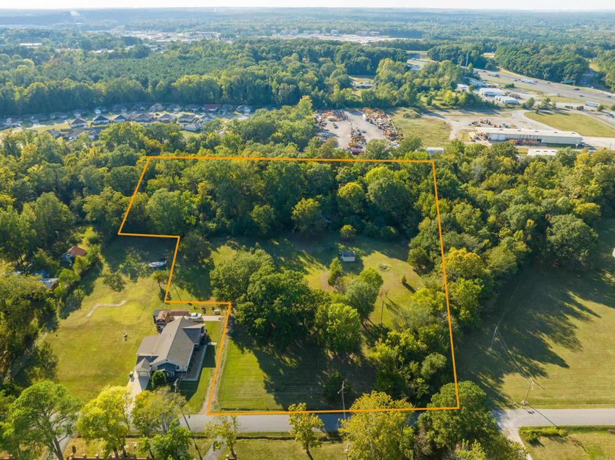 LOCATION, LOCATION, LOCATION! Great 5.81 acre piece that's just a hop, skip, and jump from I-30 and Bass Pro Shop. Beautiful acreage with utilities available and a barn is also on the land.